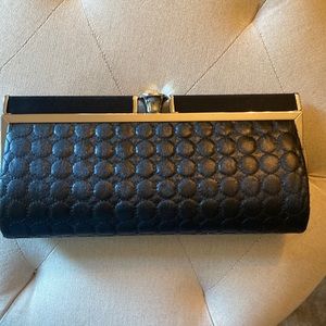 Black clutch or has strap. Excellent condition!